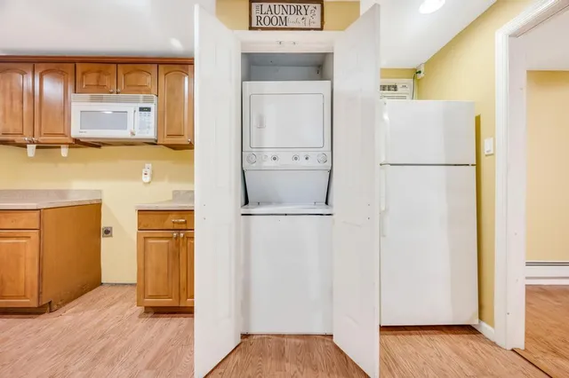 a view of a kitchen with a refrigerator a sink and dishwasher
