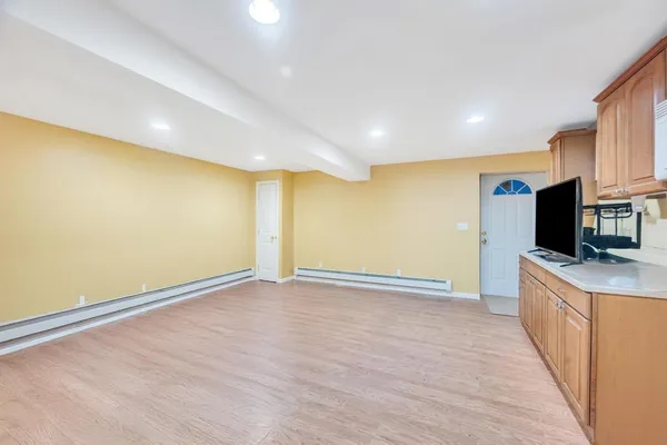 a view of a kitchen with a sink and a microwave