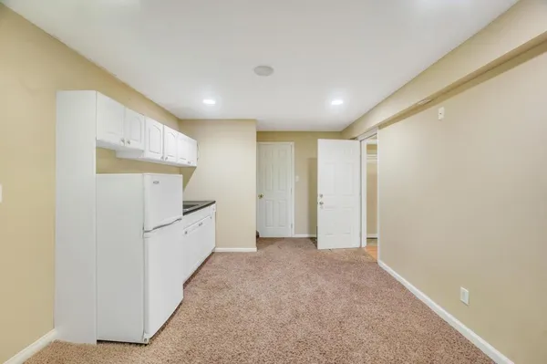 a view of hallway with furniture