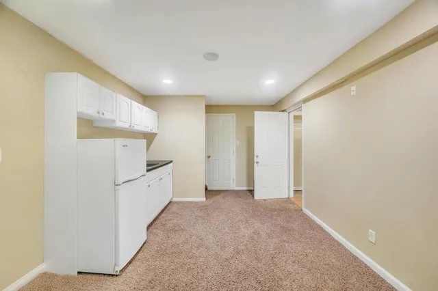 a view of hallway with furniture