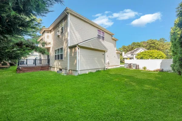 a view of a house with a backyard