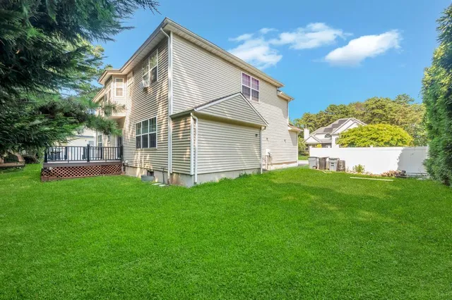 a view of a house with a backyard