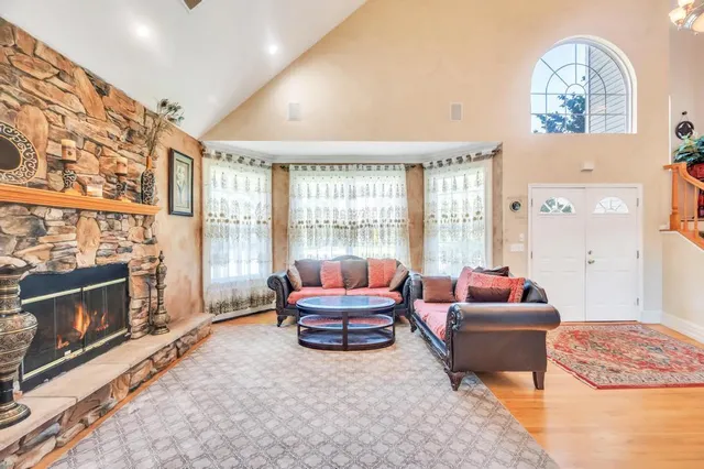 a living room with furniture windows and a fireplace