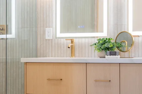 a bedroom with a bed and a lamp