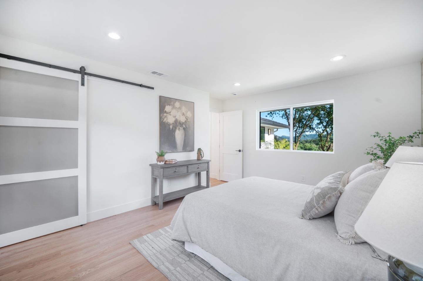 2275 Llagas Road Morgan Hill, CA 95037 - Photo 27 of 56 a bedroom with a bed and a table