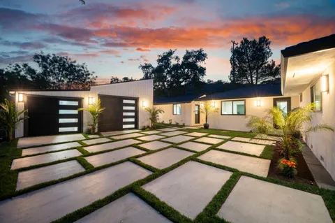 a view of house with yard