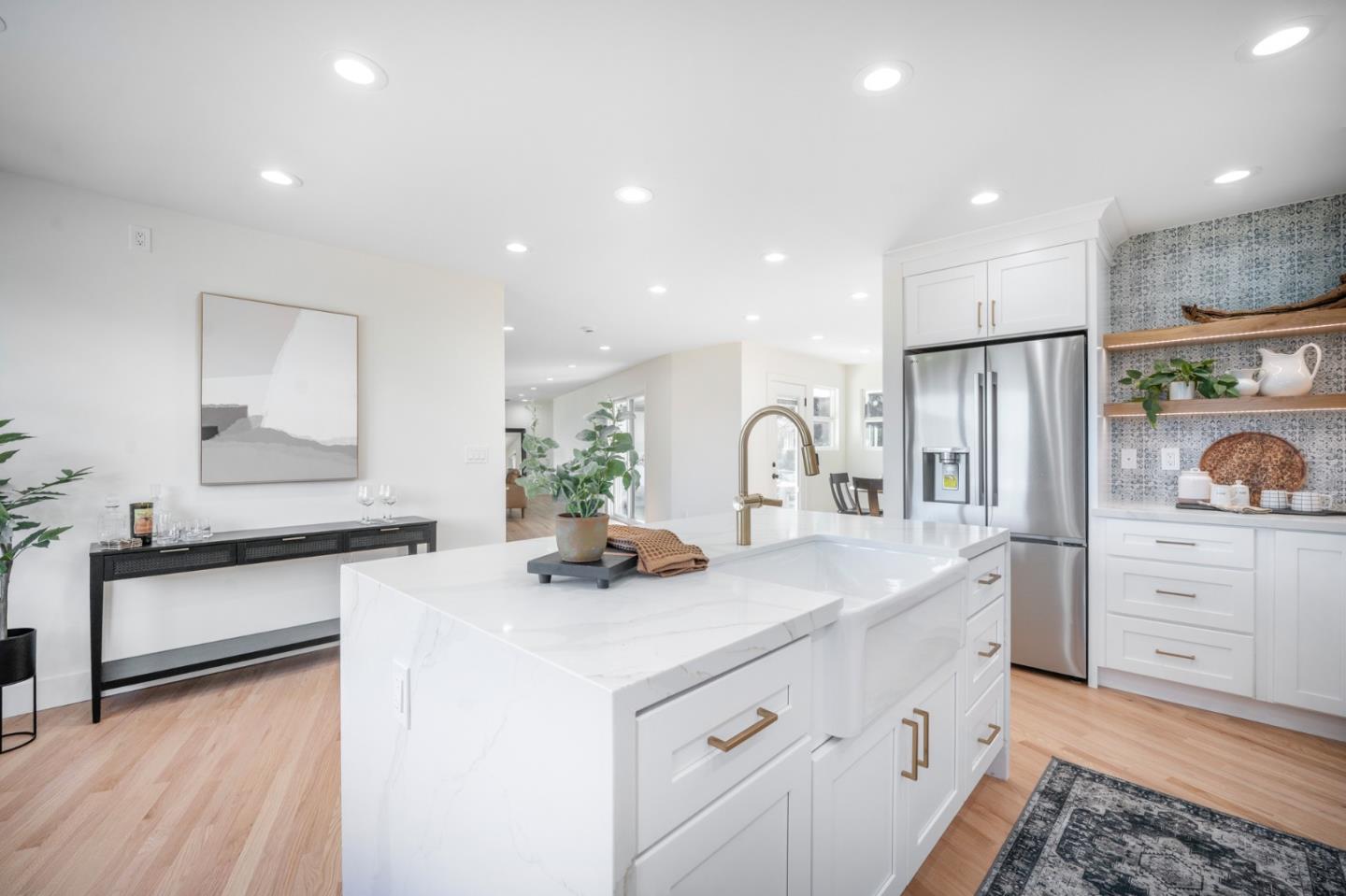 2275 Llagas Road Morgan Hill, CA 95037 - Photo 7 of 56 a kitchen with white cabinets and stainless steel appliances