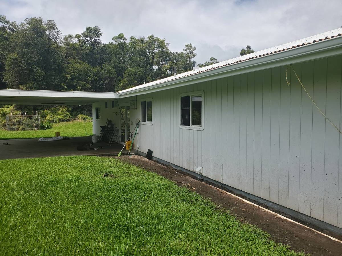 18-1455 Ihope Road Mountain View, HI 96771 - Photo 9 of 11 a backyard with a garden and plants