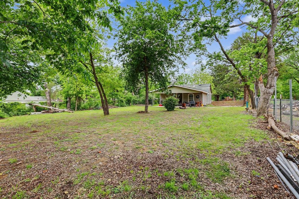 205 South Main Street Bonham, TX 75418 - Photo 21 of 23 a view of a house with yard and tree s