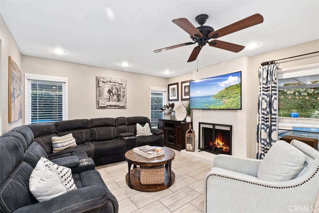21526 Vía Serpiente Lake Forest, CA 92630 - Photo 14 of 51 a living room with furniture and a fireplace