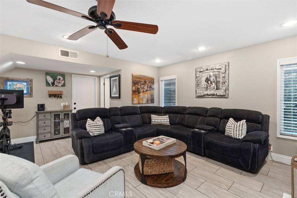 21526 Vía Serpiente Lake Forest, CA 92630 - Photo 15 of 51 a living room with furniture and a ceiling fan