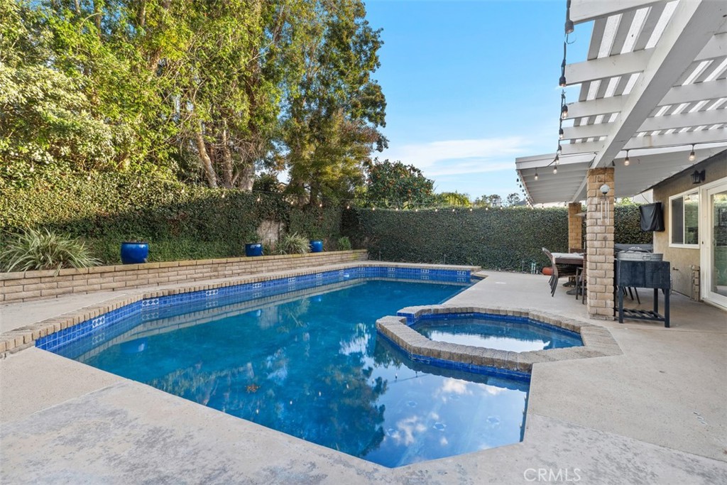 21526 Vía Serpiente Lake Forest, CA 92630 - Photo 27 of 51 a view of swimming pool with a patio and a yard