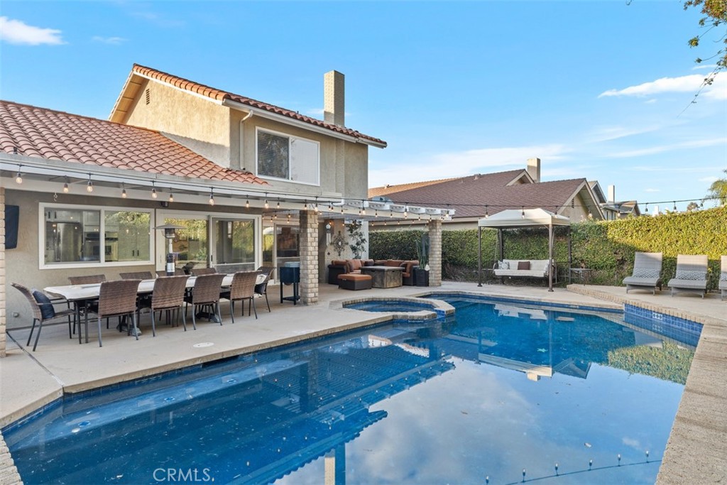 21526 Vía Serpiente Lake Forest, CA 92630 - Photo 28 of 51 a view of a house with swimming pool and sitting area