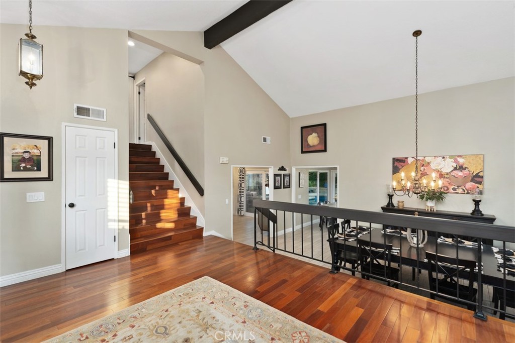 21526 Vía Serpiente Lake Forest, CA 92630 - Photo 6 of 51 a view of a hallway with wooden floor and stairs