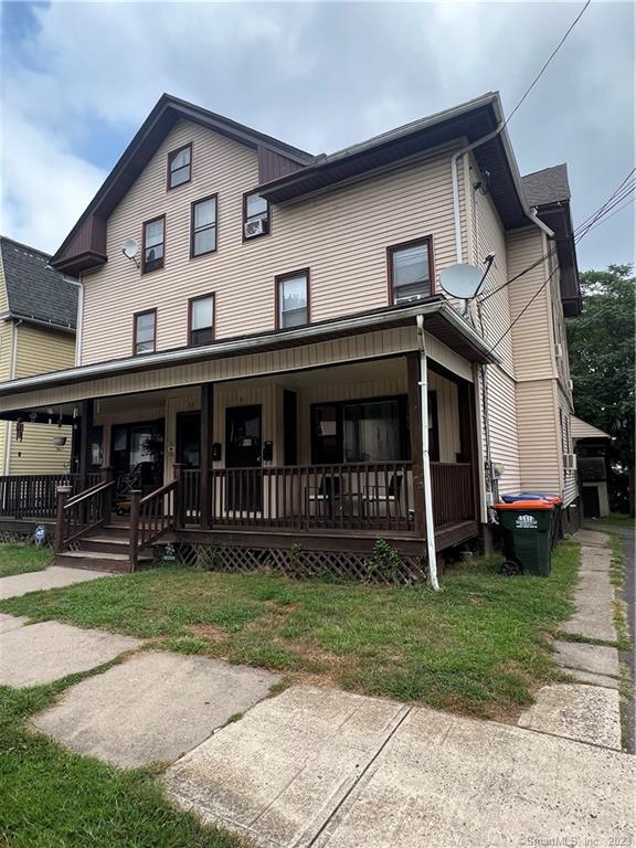 31 Tremont Street Meriden, CT 06450 - Photo 1 of 1 a front view of house with yard and green space