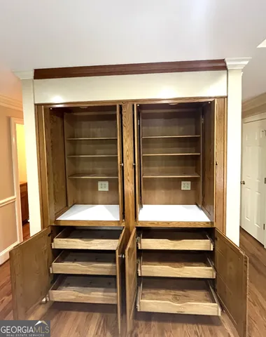 a storage room with racks on the wall
