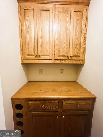 a kitchen with stainless steel appliances granite countertop a refrigerator a stove and a sink with wooden floor