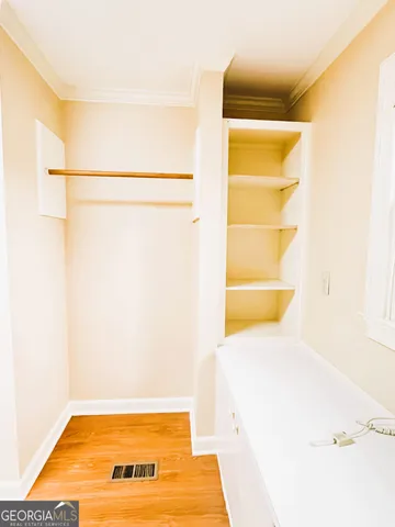 a bathroom with a sink mirror vanity and toilet