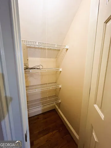 a view of a balcony with wooden floor