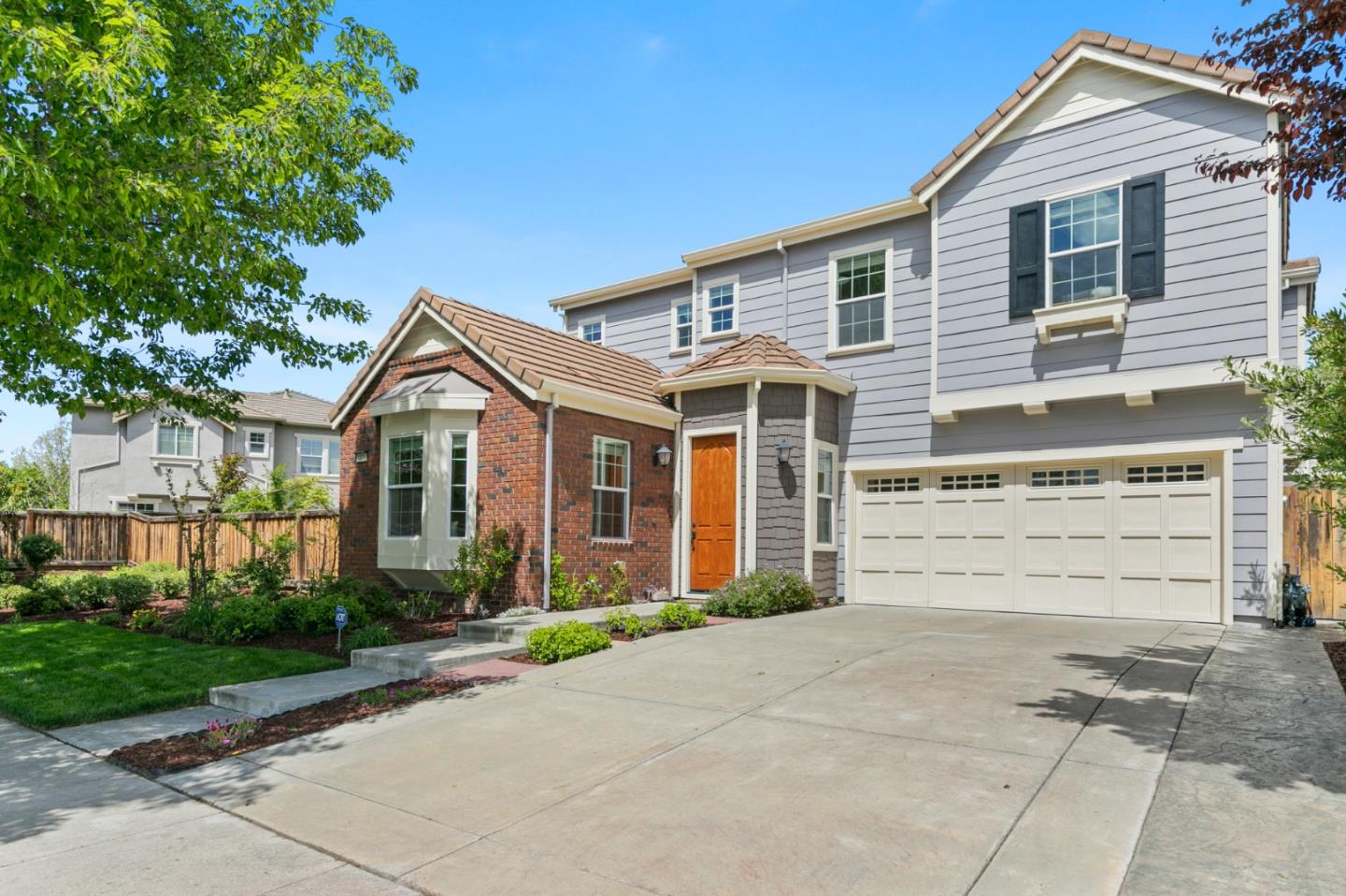 1011 Hoskins Lane San Ramon, CA 94582 - Photo 1 of 1 a front view of a house with a yard and garage
