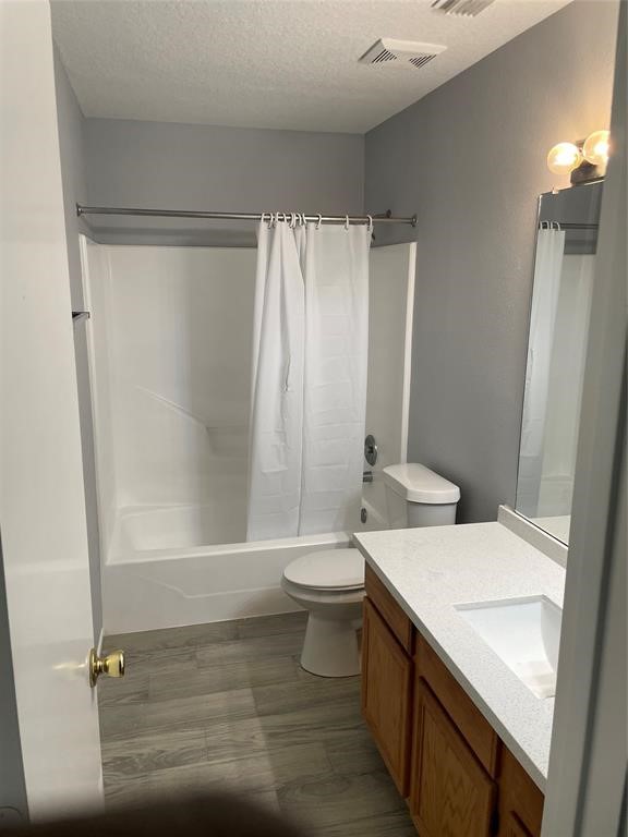 2103 Ragland Drive Houston, TX 77067 - Photo 14 of 18 a bathroom with a sink a toilet and shower