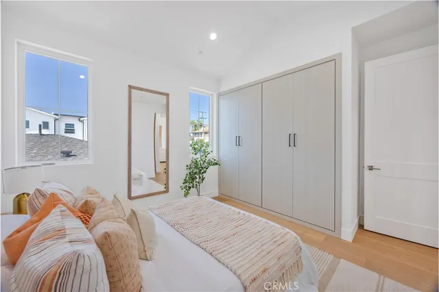 a bedroom with a bed and a couch