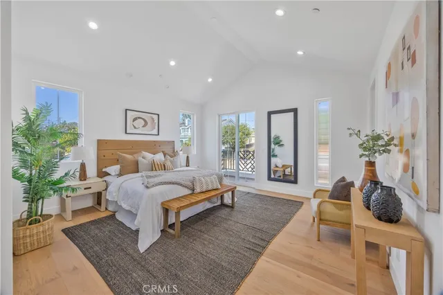 a bedroom with a large bed and a couch