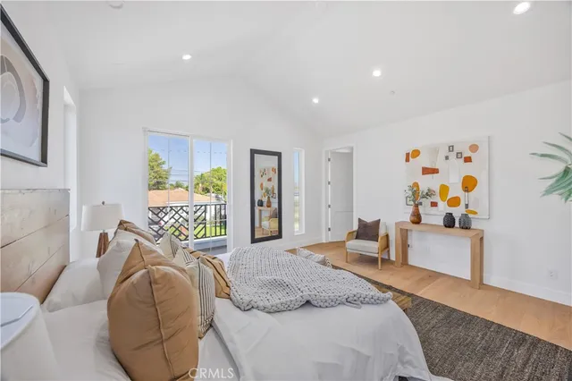 a bedroom with a bed and a couch