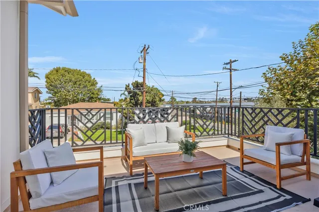 a view of a balcony with chairs