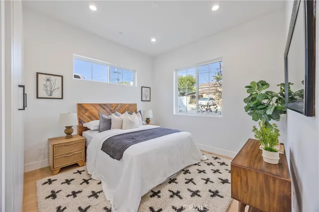 a bedroom with bed and a window