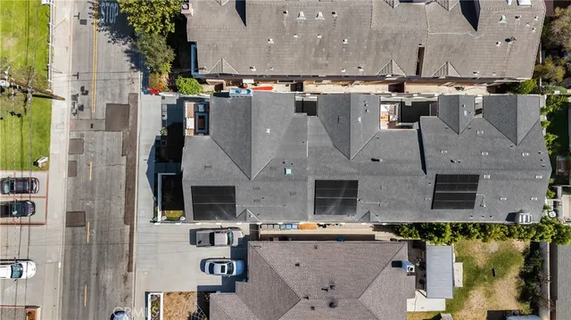 an aerial view of residential houses with outdoor space