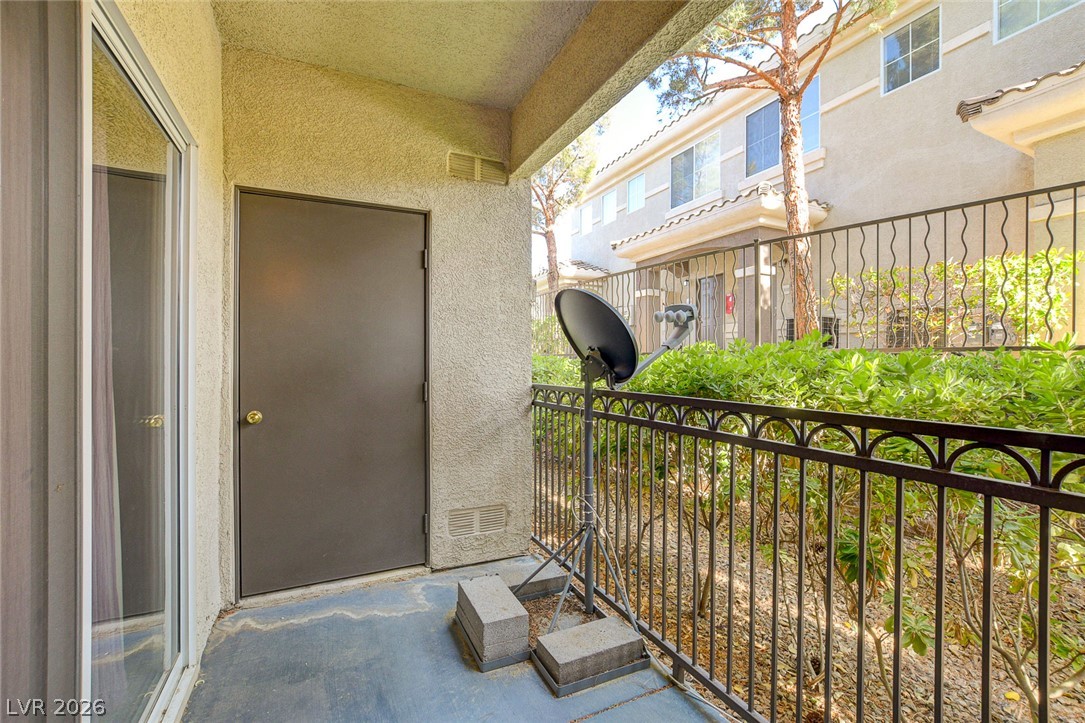 9050 West Warm Springs Road, Unit 1034 Las Vegas, NV 89148 - Photo 11 of 17 A well-lit patio area provides a seamless transition to the outdoors, ideal for enjoying serene moments.