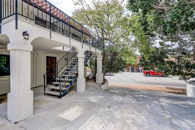 a kitchen with a stove top oven and refrigerator
