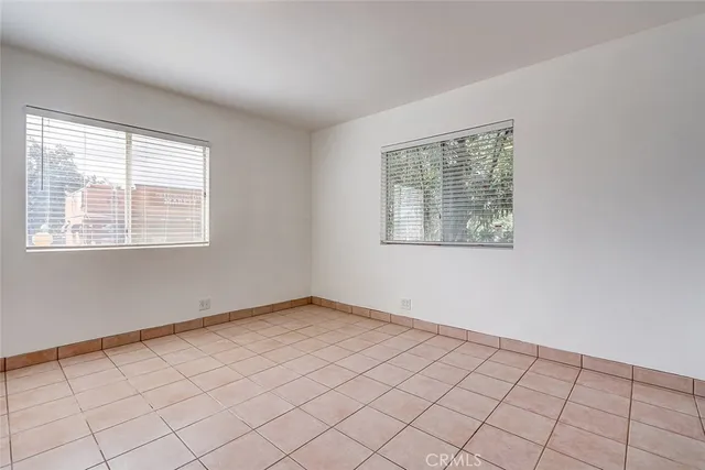 a kitchen with stainless steel appliances granite countertop a stove a sink dishwasher and a refrigerator