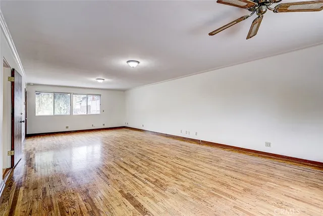a view of hallway with microwave and cabinets