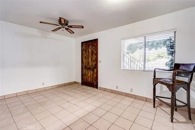 a kitchen with stainless steel appliances kitchen island granite countertop a refrigerator and a stove top oven