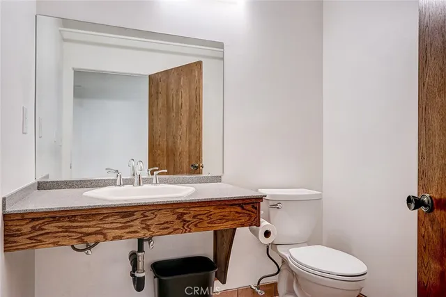 a kitchen with stainless steel appliances a refrigerator and a stove top oven