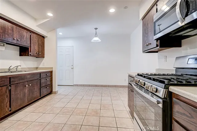a large room with wooden floor and natural light