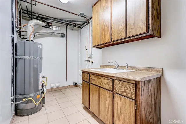 a hallway with couches and wooden floor