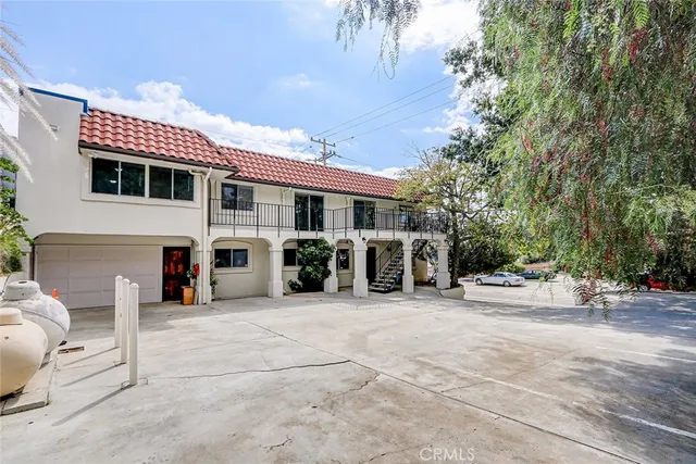 a view of an chairs and table in a room