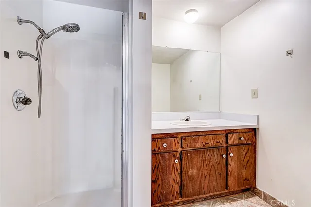 a kitchen with stainless steel appliances granite countertop a stove and a refrigerator