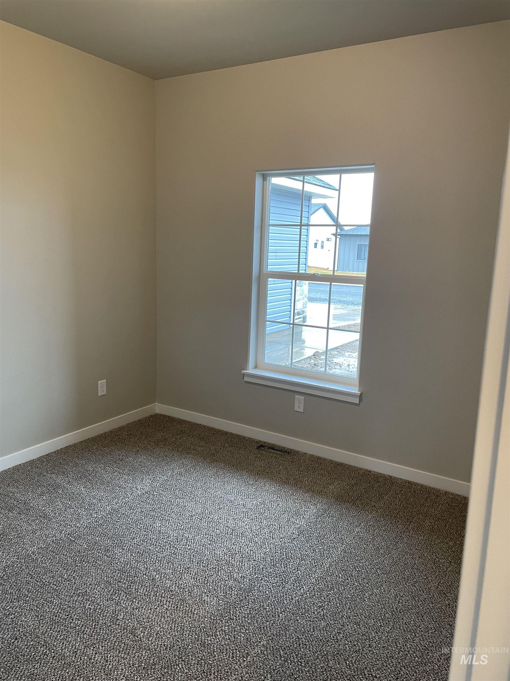 1123 Frank Henry Road Twin Falls, ID 83301 - Photo 15 of 20 Carpeted spare room featuring baseboards