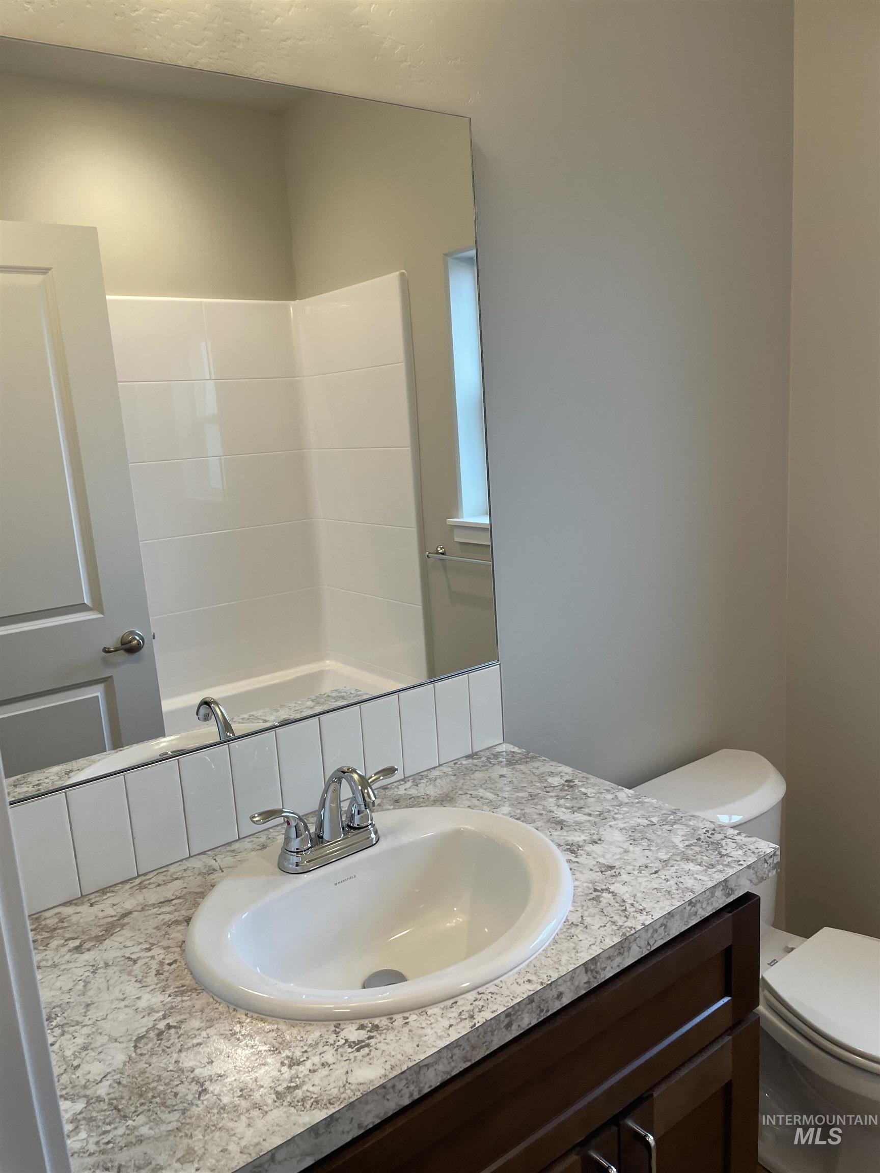 1123 Frank Henry Road Twin Falls, ID 83301 - Photo 17 of 20 Bathroom with vanity and toilet