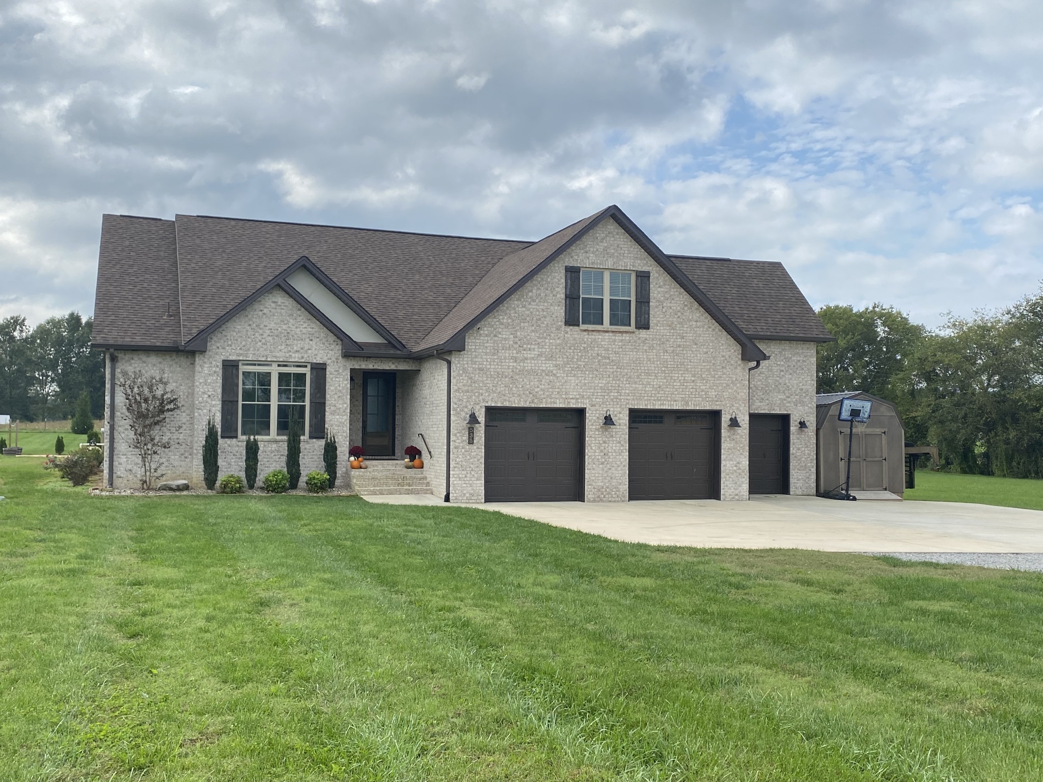535 Tom Link Road Cottontown, TN 37048 - Photo 1 of 37 a front view of a house with a yard and trees