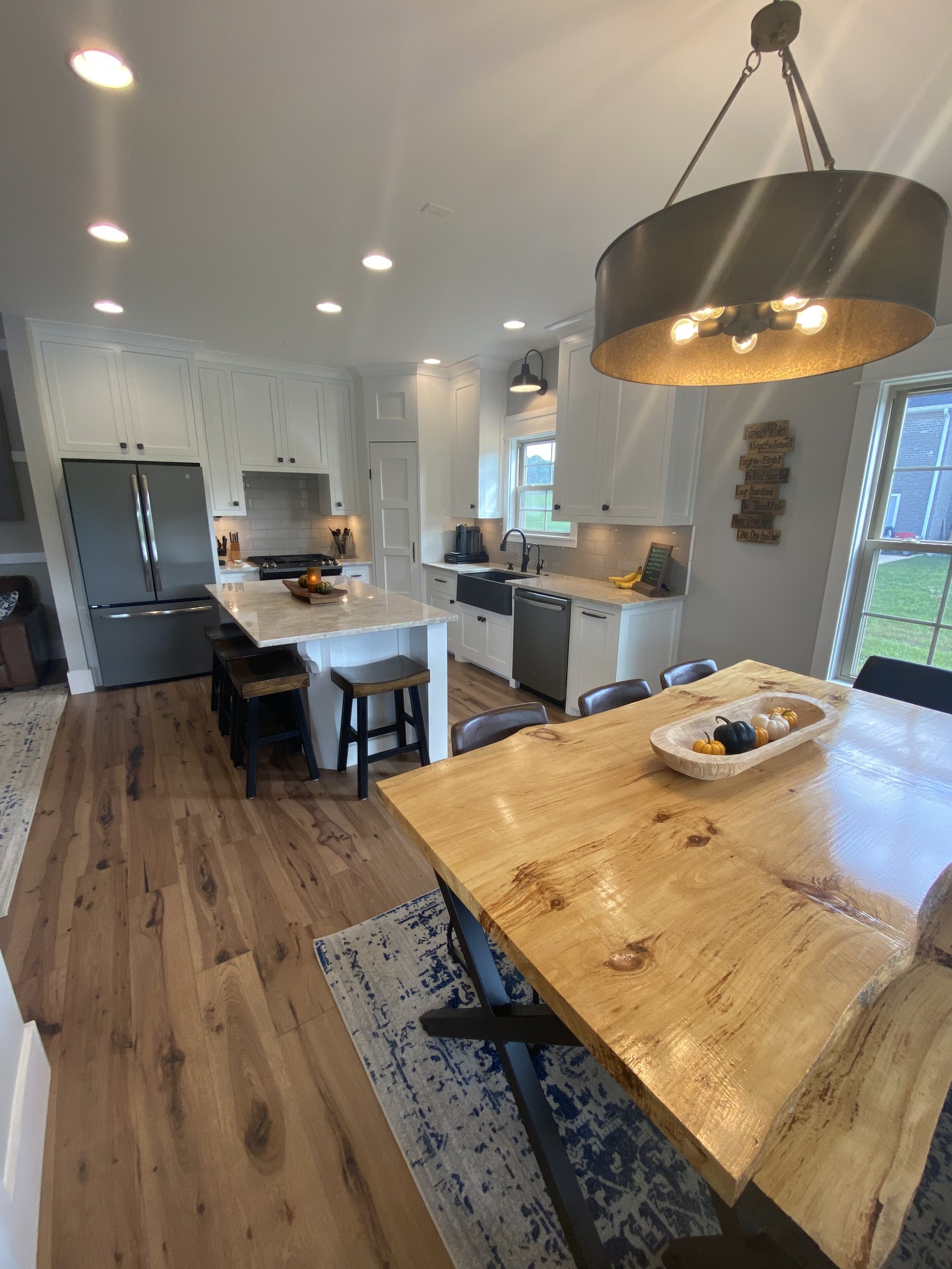 535 Tom Link Road Cottontown, TN 37048 - Photo 13 of 37 a kitchen with stainless steel appliances granite countertop a sink dishwasher and a stove with wooden floor
