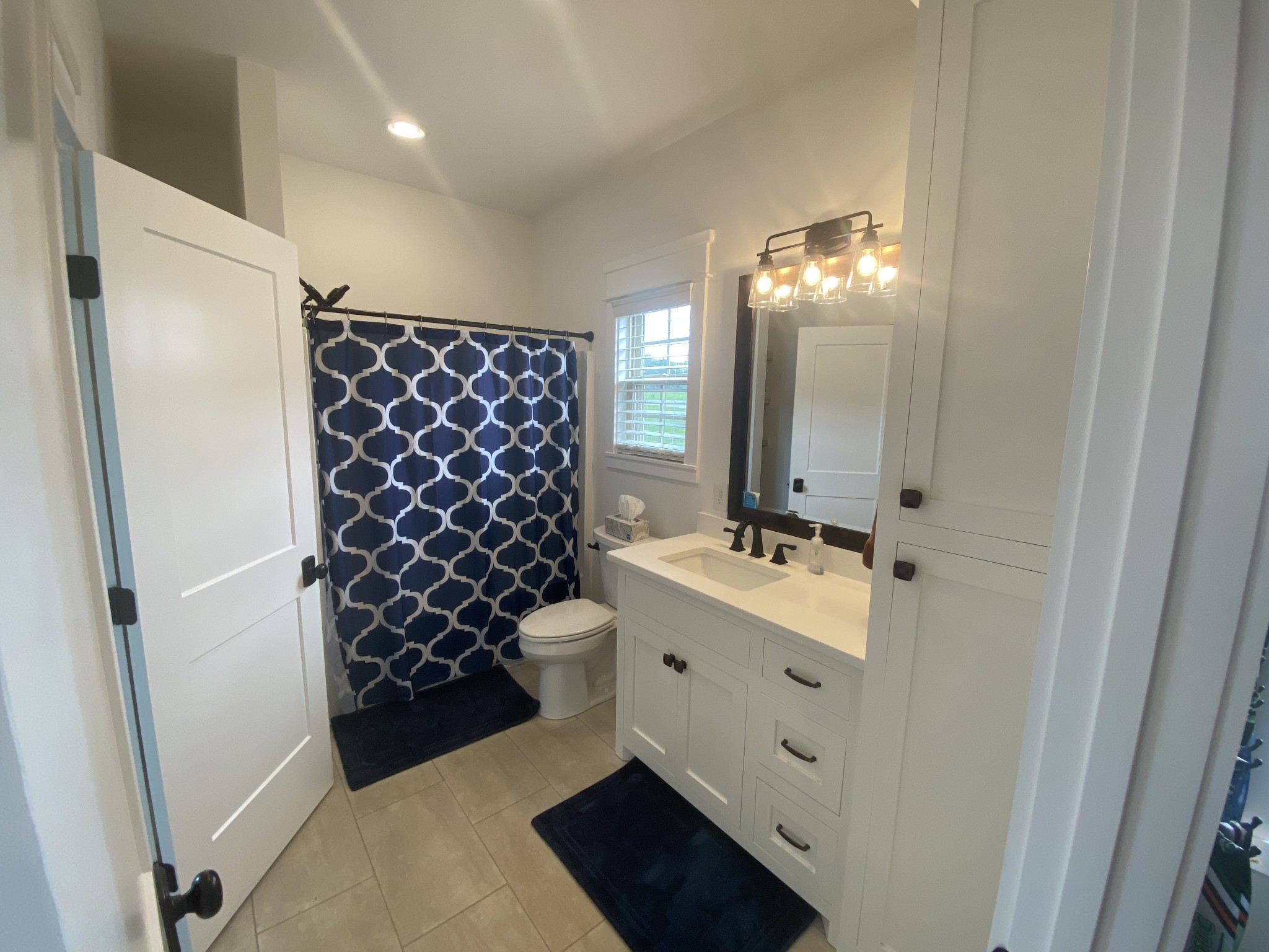 535 Tom Link Road Cottontown, TN 37048 - Photo 23 of 37 a bathroom with a sink toilet and shower