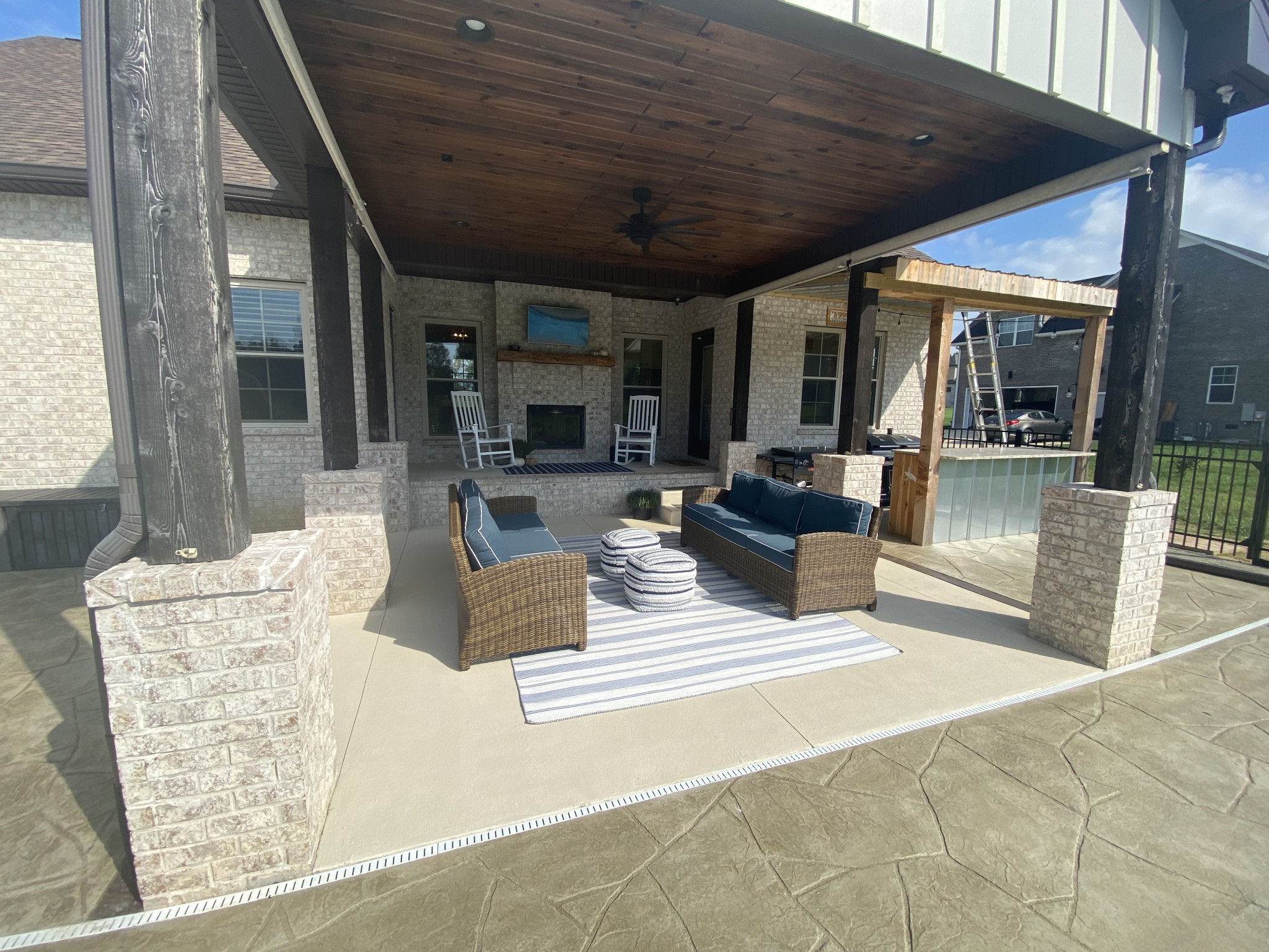 535 Tom Link Road Cottontown, TN 37048 - Photo 36 of 37 a view of the patio with couches and chairs under an roof