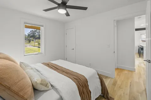 a bedroom with a bed and a window