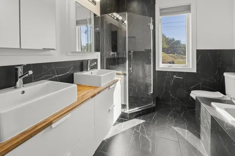a bathroom with a bathtub sink and toilet