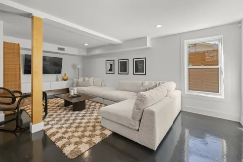 a living room with furniture or couch and a window